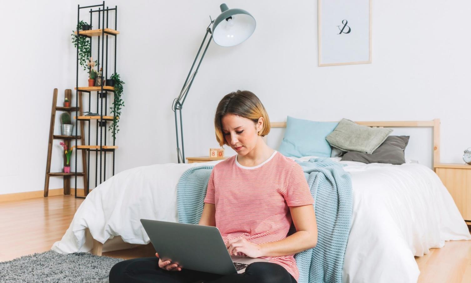 Student working on financial modeling spreadsheet with charts and data analysis